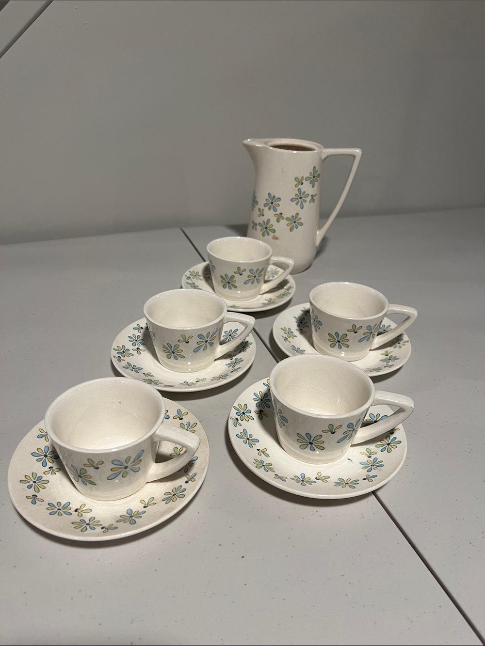 1970’s children’s floral china tea set. 5 cups & saucers, one tea pot/pitcher.